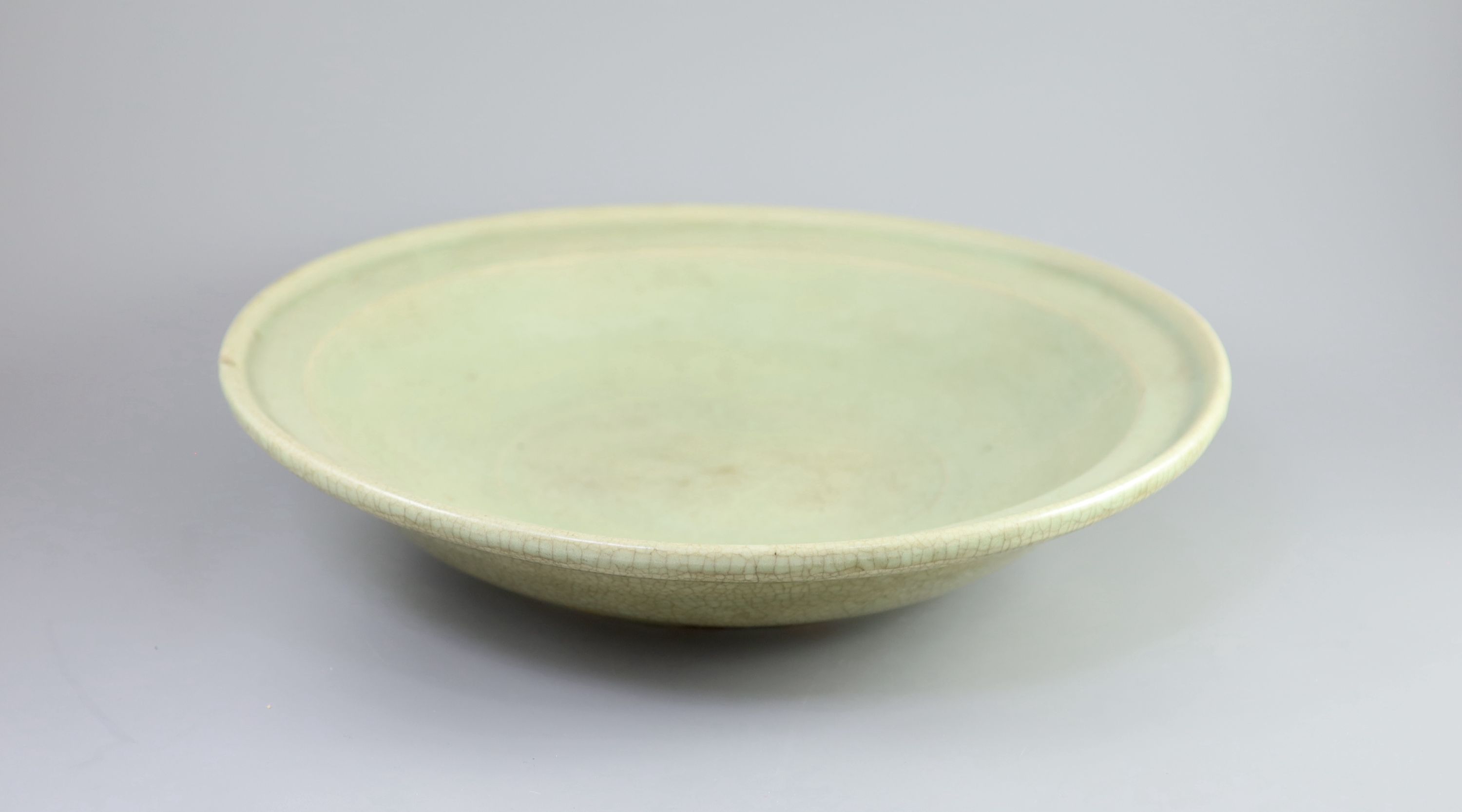 A Chinese Ming Longquan celadon dish, 15th/16th century, 43cm diameter